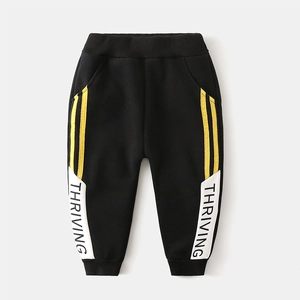 Boys black fleece track pants with yellow stripes and white thriving text print