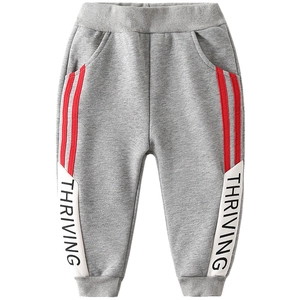 Thick grey winter joggers for boys with red side stripes and Thriving letter print