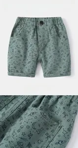 Detail of kids' space cartoon shorts featuring stretch twill fabric and side pockets