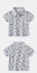 Detail view showing gray polo shirt with all-over dinosaur and elephant cartoon print