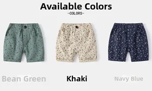 Close-up of boys' cotton shorts with space prints in bean green, khaki and navy blue colors
