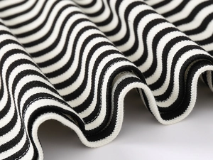 Macro detail of high-quality black and white striped knit fabric with soft cotton texture