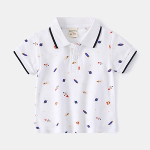 Detail of boys polo shirt showing printed rockets and navy stripes on ribbed collar