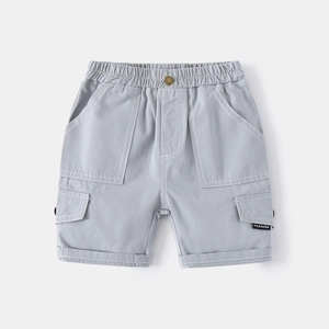 Macro view of blue cotton cargo shorts featuring elastic waistband and contrast stitching