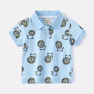 Detail of baby polo shirt collar with lion pattern and size label showing 90/52