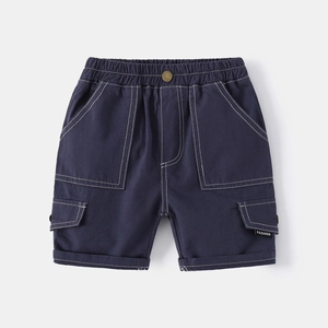Detail of dark blue cargo shorts featuring white contrast stitching and a fashion pocket tag