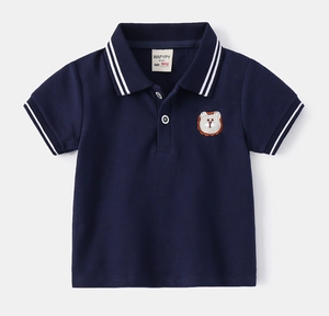 Detail of navy polo shirt showing white stripes on collar and bear embroidery