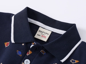 Close-up of navy blue polo collar with white stripes and cartoon space pattern