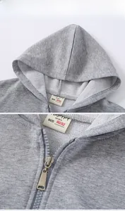 Détail du sweat à capuche zippé gris pour enfant, tissu en coton éponge et étiquette intérieure