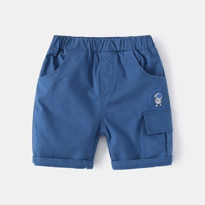 Detail view of elastic waist and navy cotton shorts with astronaut print and cargo pocket