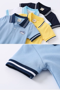 Detail of children's cotton polo shirt showing stripe cuffs and cat embroidery