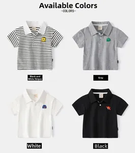 Detail of kids polo shirts showing striped, grey, white, and black colors with embroidery