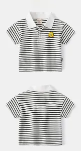 Front and back view of children's black and white striped Polo shirt with yellow dinosaur