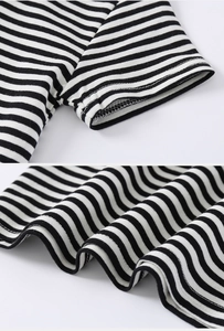Close-up of high-quality stitching and soft cotton striped fabric on kids polo shirt