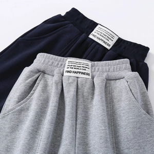 Deep blue and light grey cotton joggers with elastic waist and stitched label design