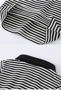 Detail of classic black and white striped polo shirt with collar and stitching