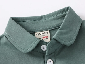 Close-up of kids polo shirt neckline with soft collar and white button details