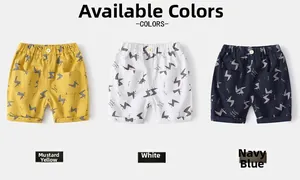 Detailed flat lay of boys' cotton shorts in ginger, white, and navy with lightning patterns