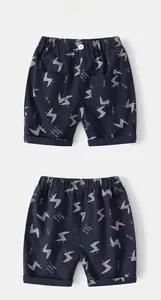 Front and back view of navy cotton boy shorts with lightning prints and elastic waist