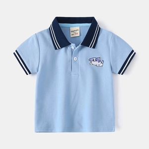 Light blue kids polo shirt with navy collar and cat embroidery on a gray background