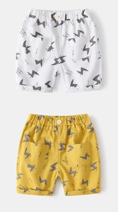 Detail of cotton boys' shorts with lightning print, elastic waist and patch pockets