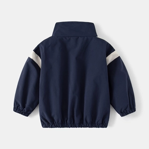 Boys navy blue windbreaker jacket with white patchwork design, rear view back display