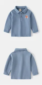 Detail of light blue kids' long-sleeve polo shirt with bear embroidery and soft fleece texture