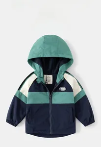 Detail view of boys color-block windbreaker with warm polar fleece lining and hood