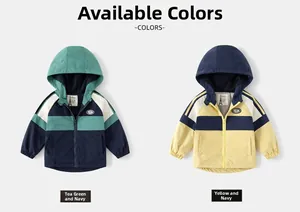 Detail view of two boys' hooded windbreakers in mustard green and yellow colorblock design