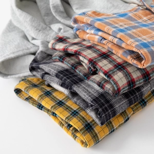 Boys hooded plaid shirts stacked in various colors made of premium cotton fabric