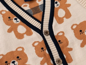 Detail of V-neck knit cardigan featuring cute bear jacquard and vintage button accents