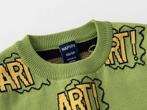 Close-up of green knit sweater with yellow ART! lettering and ribbed neckline detail