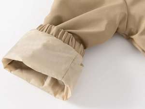 Detailed view of khaki sleeve cuffs with elastic bands and smooth polyester lining
