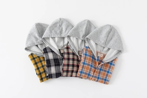 Detailed flat lay of children's hooded plaid shirts in yellow, white, red and orange colors