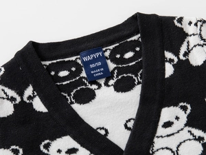 Detail of V-neckline and brand label on a knit cardigan with cartoon bear jacquard pattern