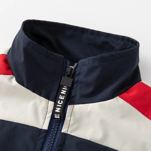 Boys color block windbreaker jacket with stand collar and zipper detail in navy and red