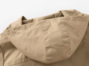 Detail shot of a khaki hooded jacket showing high-quality double stitching and fabric