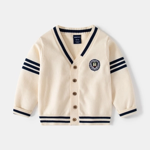 Detail view of V-neck knitted cardigan featuring classic navy stripes and embroidery