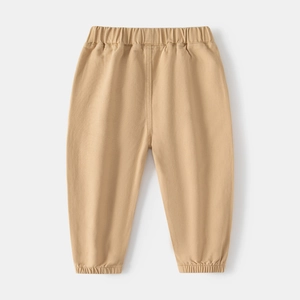 Detailed view of elastic waistband and cuffs on khaki cotton joggers for boys