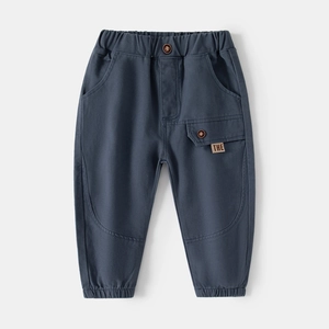 Detailed close-up of dark grey kids casual trousers with elastic waist and side pocket