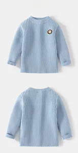 Detailed view of light blue ribbed knit sweater with cute lion embroidery for boys