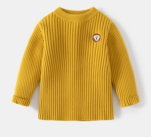 Close-up of yellow ribbed knit sweater for boys featuring a cute monkey patch