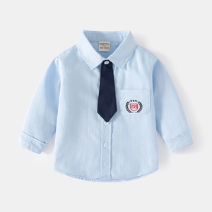 Classic light blue boy's long sleeve formal shirt with dark blue tie and crest embroidery