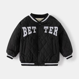 Detail of kids black quilted jacket with white BETTER letter embroidery and fleece lining