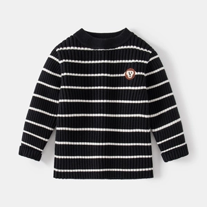 Boy's thick knit sweater with classic black and white stripes and monkey patch