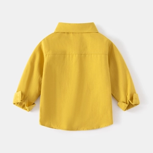 Back view of a ginger yellow long-sleeved cotton shirt for boys with a classic collar