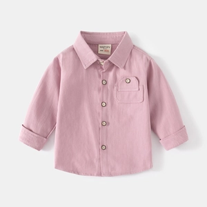 Close-up of pink children's long-sleeve shirt showing buttons, chest pocket, and collar detail