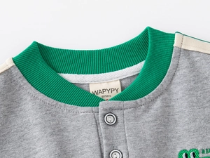 Detail of kids grey sweatshirt showing green ribbed neckline and brand label WAPYPY