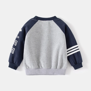 Detail of raglan sleeves on gray and navy blue kids sweatshirt with white sleeve stripes