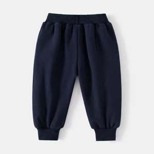 Detailed flat lay of dark blue boys joggers with elastic waist and ribbed cuffs